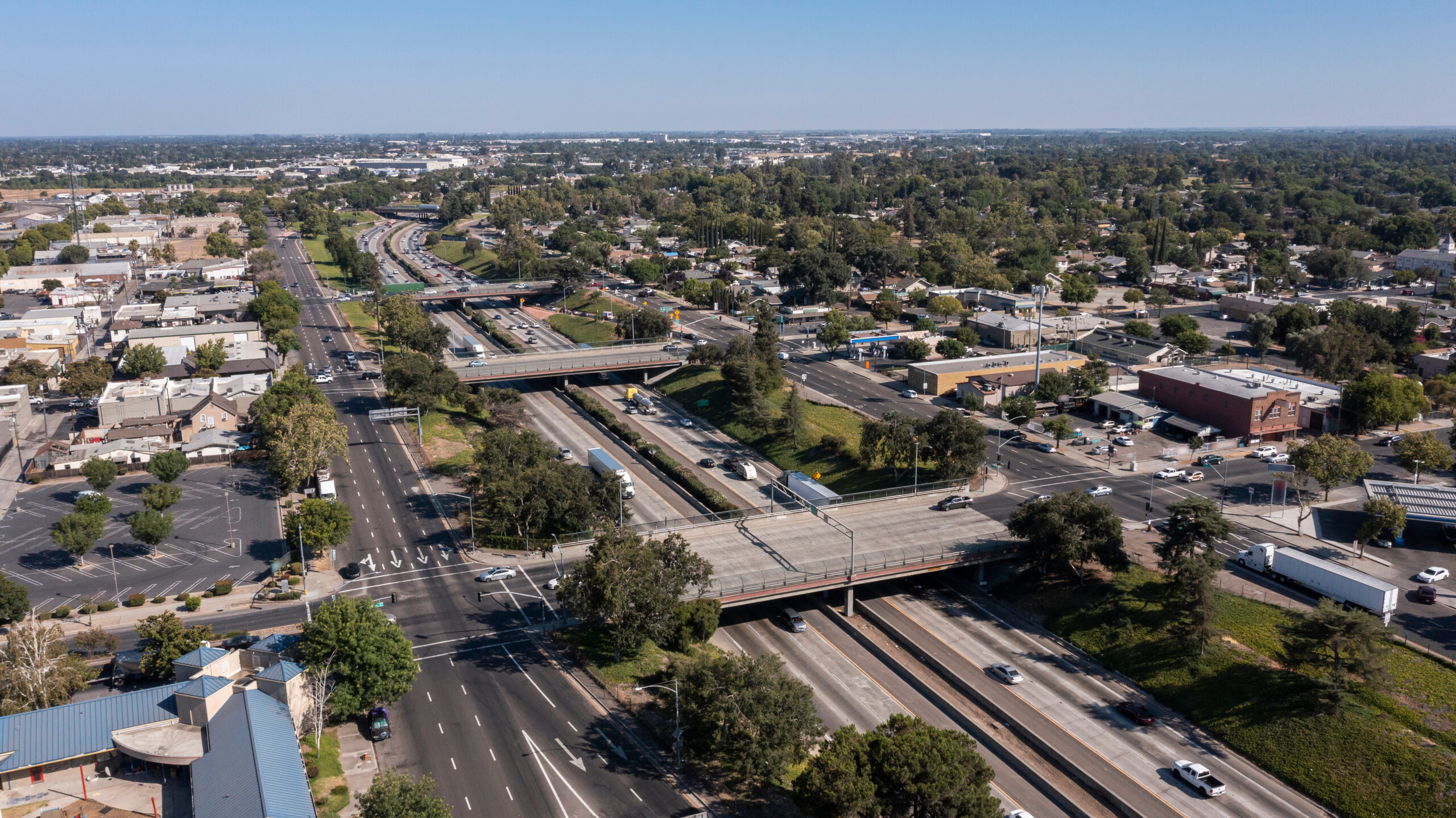 Afternoon aerial view of the 99 Freeway and urban downtown core of Modesto, California, USA.