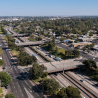 Afternoon aerial view of the 99 Freeway and urban downtown core of Modesto, California, USA.